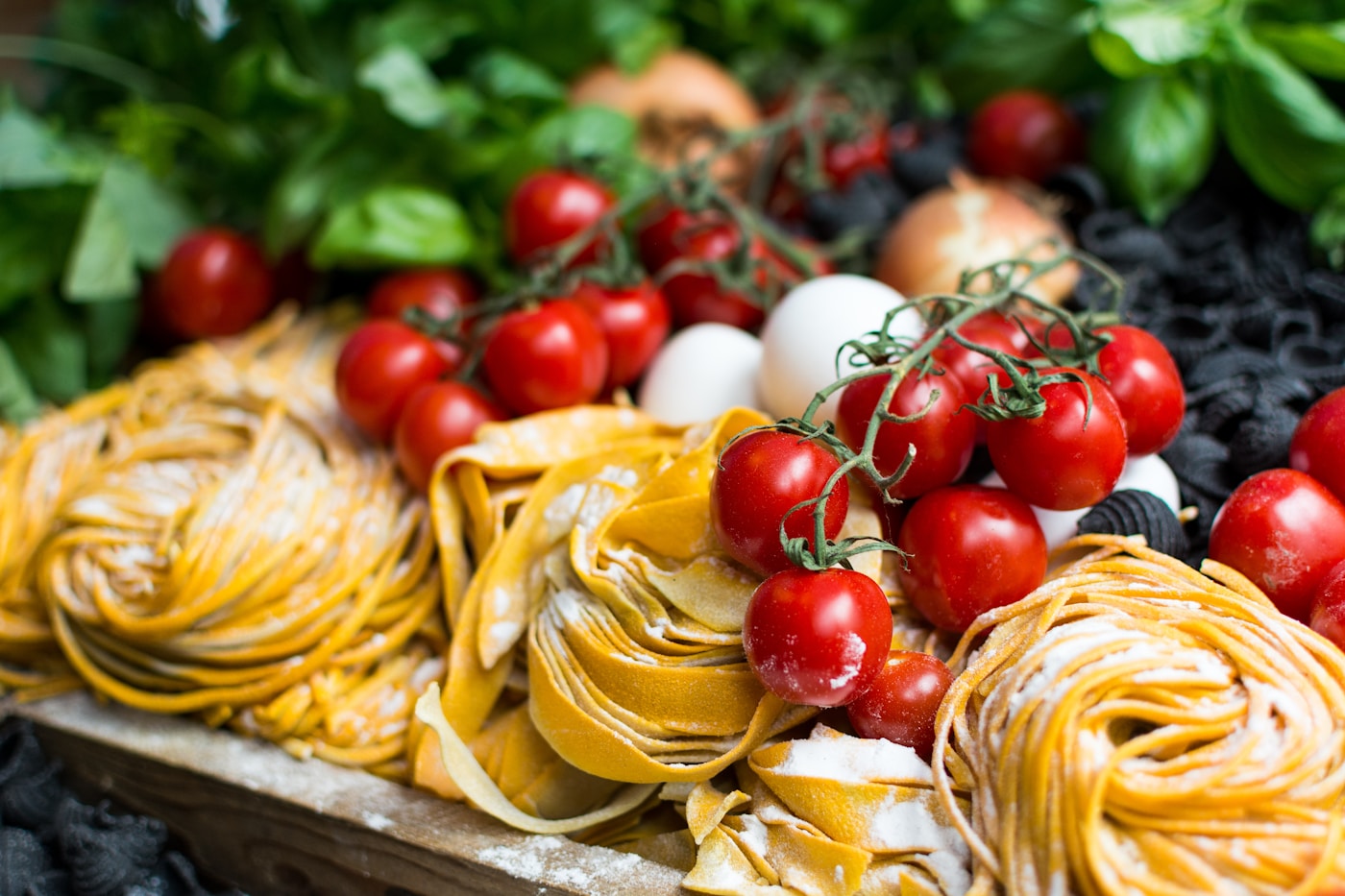 Chef preparing fresh Italian dishes in the kitchen